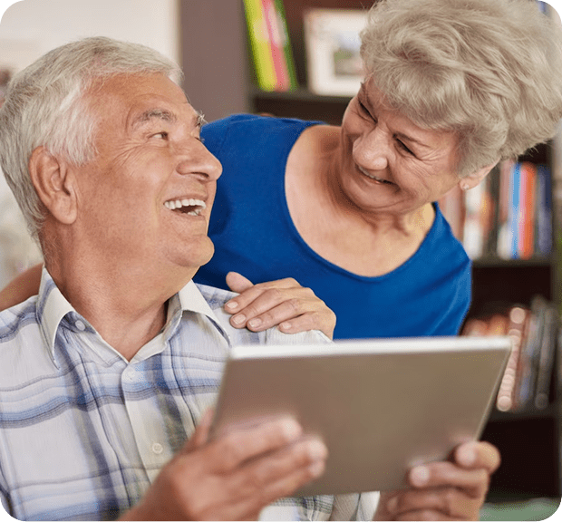 A woman and an old man viewing the Medicare costs