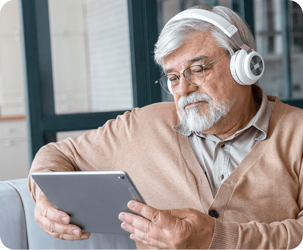 A man looking at his tablet to determine which Medicare plan is right for him